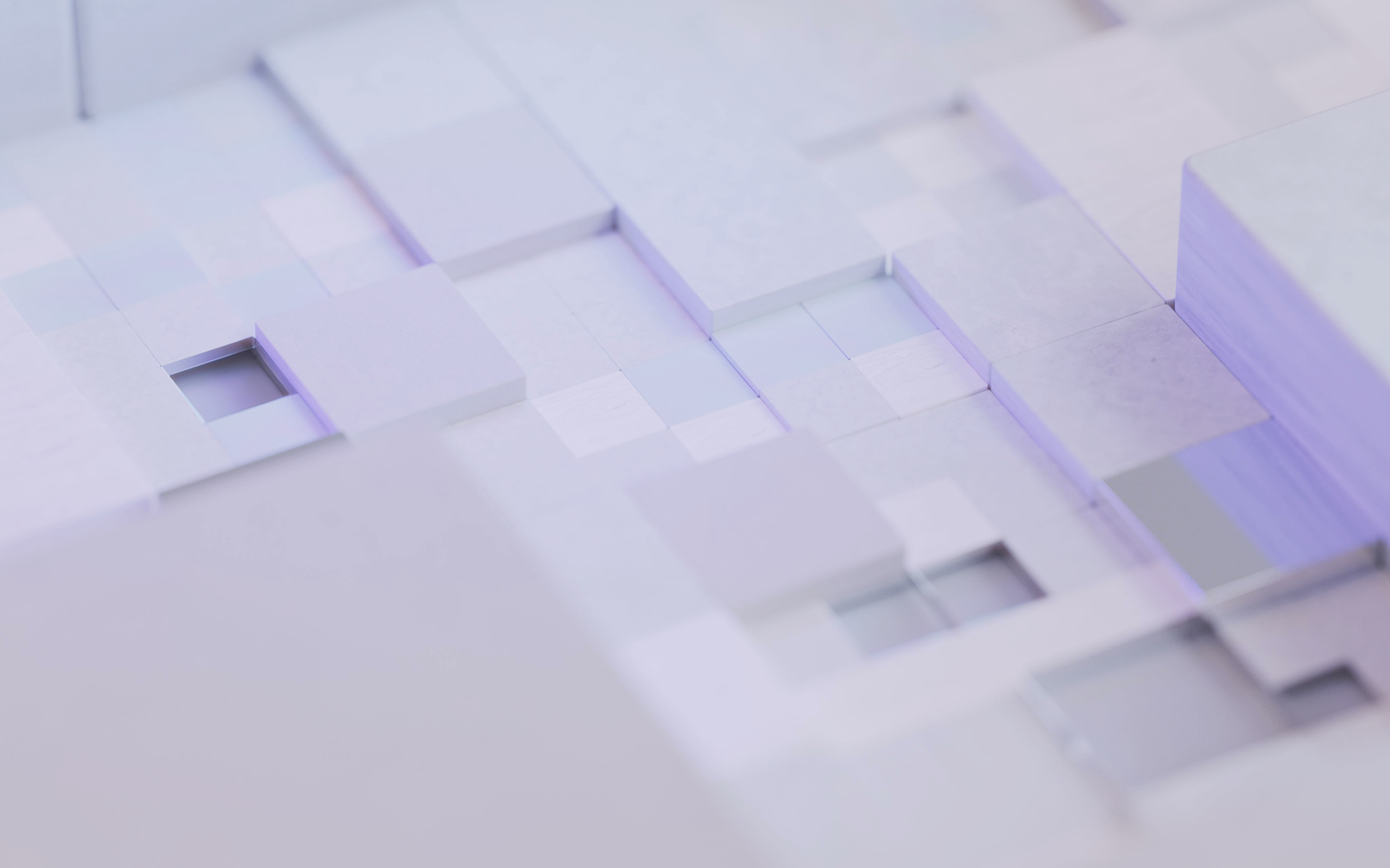 An abstract image of cubes mixing into each other with a purple overlay