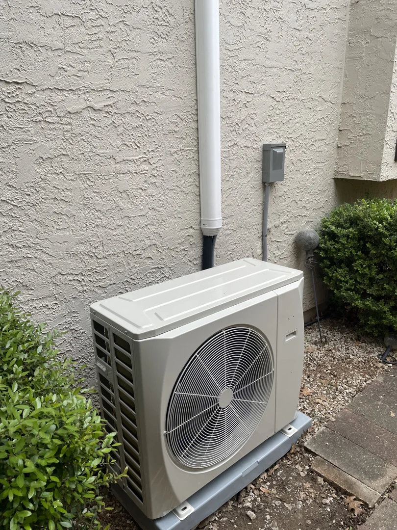 A dirty condenser coil covered in dust and organic debris restricting airflow A dirty condenser coil covered in dust and organic debris restricting airflow