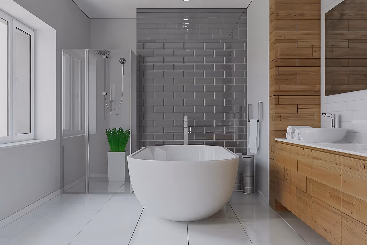Modern bathroom with white bathtub, gray tiles, and wooden vanity