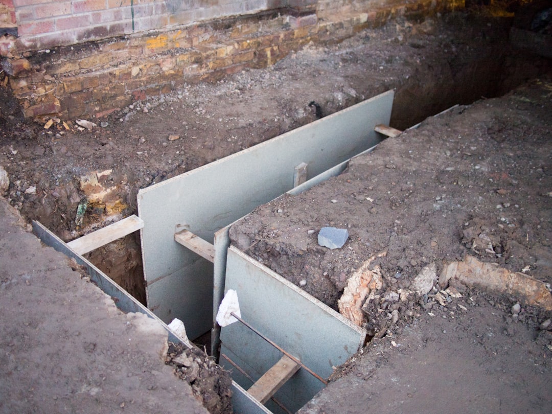 Construction site with metal formwork for concrete foundation