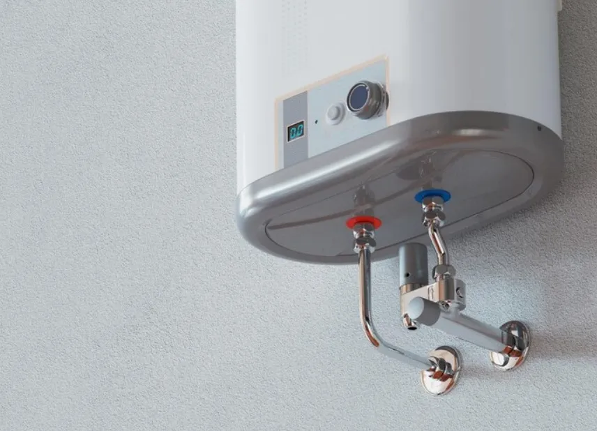 Electric water heater mounted on wall with control panel and pipes