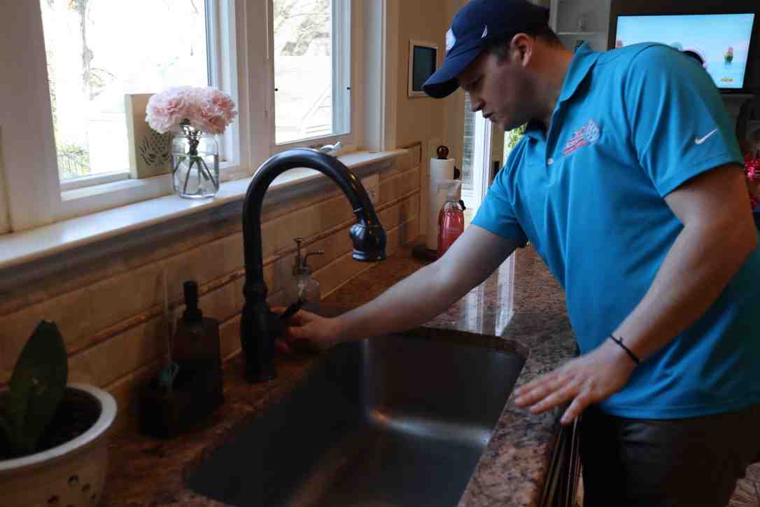 small plumbing snake or auger - Fix clogged kitchen drain