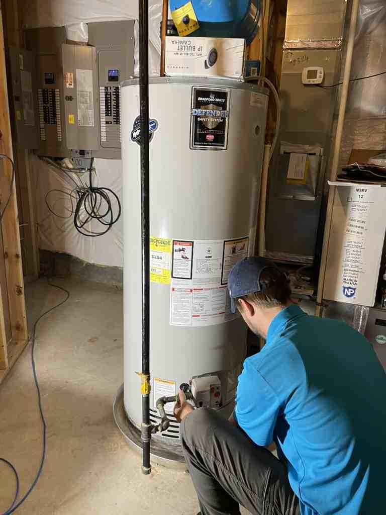 compact tankless water heater mounted on a wall - Arlington water heater repair