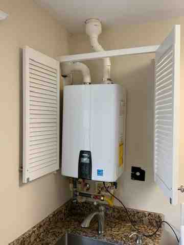 Plumber installing tankless water heater - 120 volt tankless water heater for shower Plumber installing tankless water heater - 120 volt tankless water heater for shower