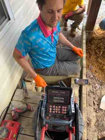 Technician performing a video camera inspection of a pipe - hydro jetting northern virginia