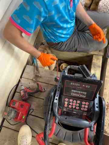 plumber performing a video camera pipe inspection - galvanized pipe inspection northern va