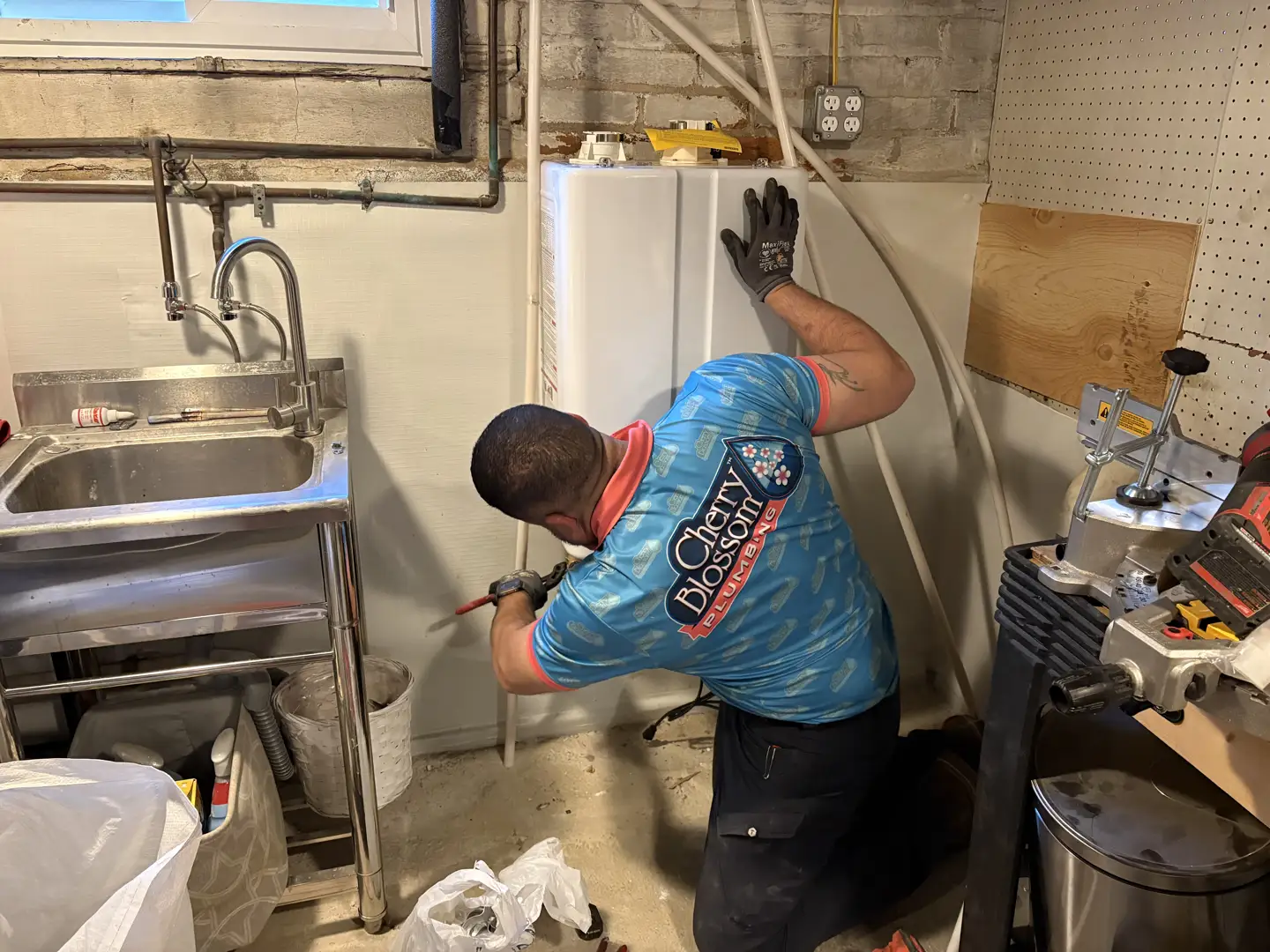 professional plumber installing a wall-mounted tankless water heater in a clean utility room - how long does a tankless professional plumber installing a wall-mounted tankless water heater in a clean utility room - how long does a tankless