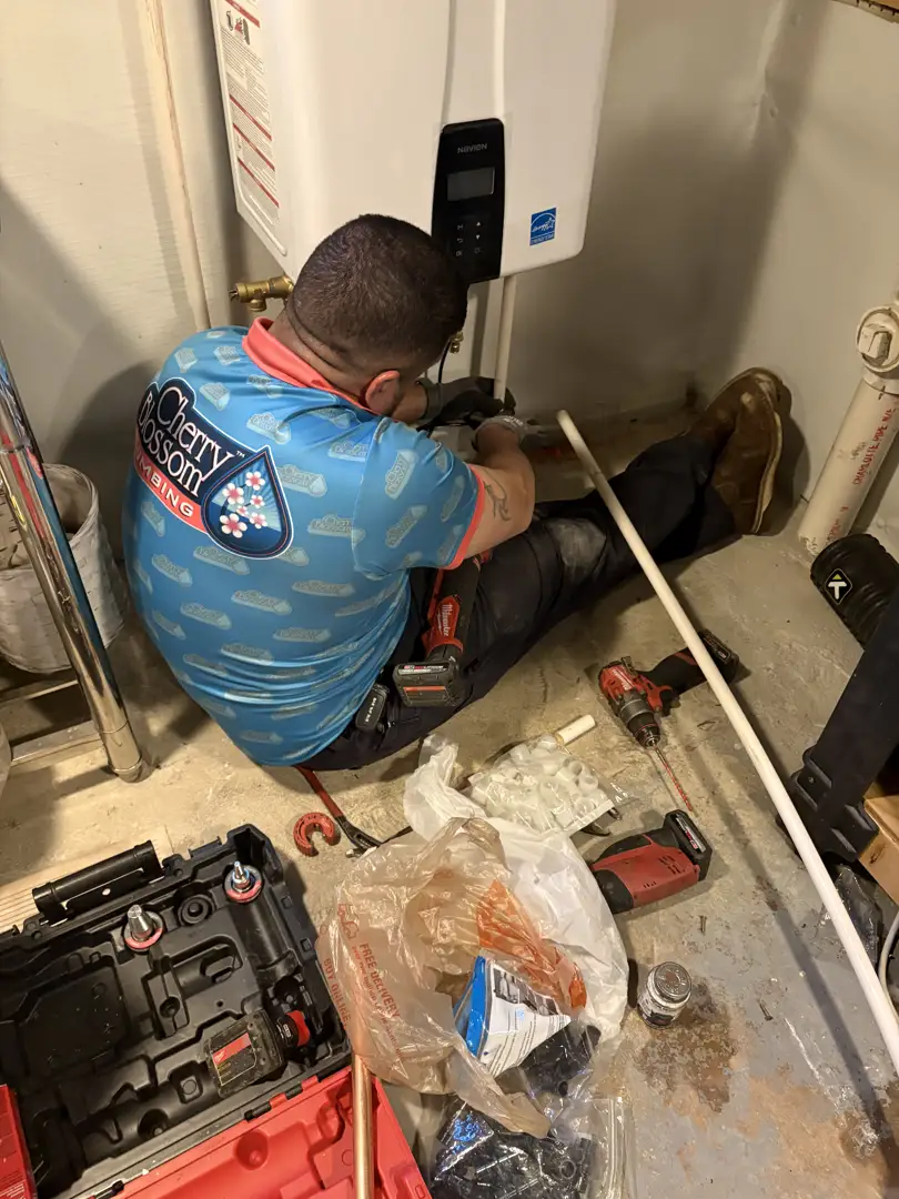 Professional plumber inspecting water lines in a crawlspace to determine if a home needs a plumbing repipe Professional plumber inspecting water lines in a crawlspace to determine if a home needs a plumbing repipe