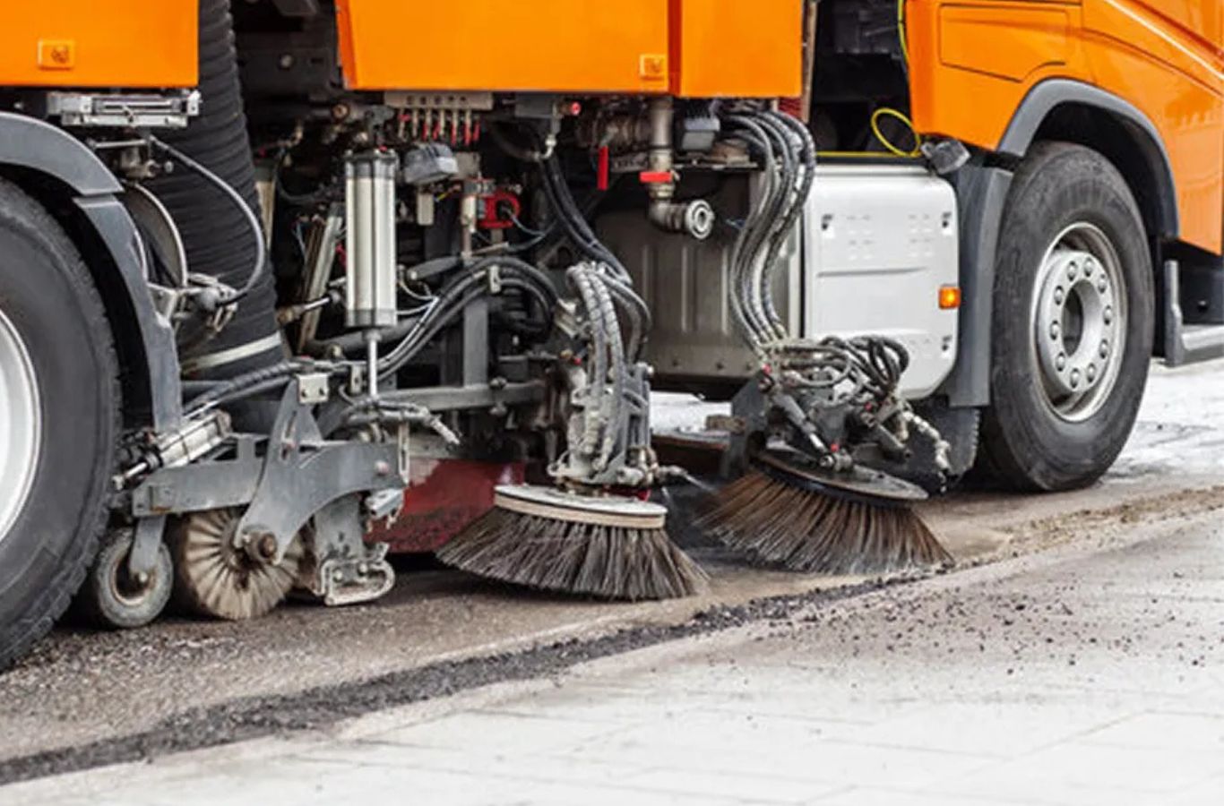 A Sundance Sweeping operator cleaning a parking lot in Gila Bend, AZ using advanced sweeping trucks for smooth, spotless results.