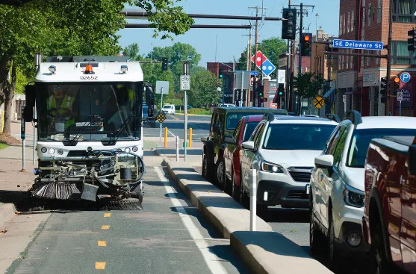 A Sundance Sweeping operator using modern sweepers to perform precise parking lot sweeping in Gilbert, AZ for businesses and retail centers.