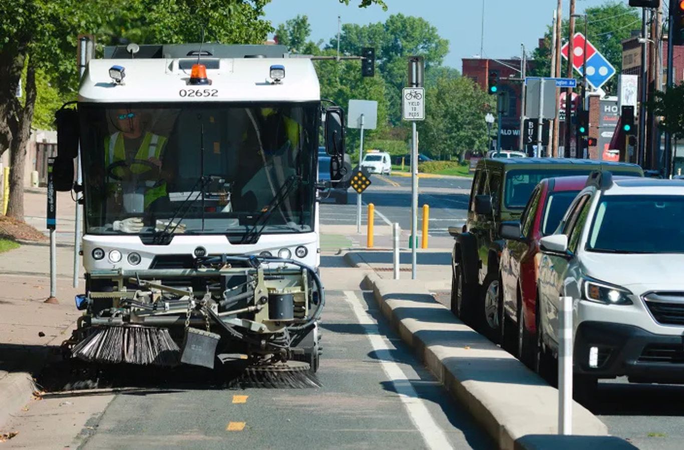 A Sundance Sweeping operator using advanced sweepers to perform professional parking lot sweeping in Glendale, AZ for commercial properties.