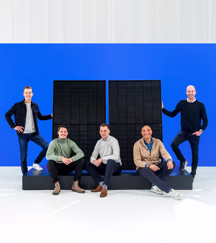 Colleagues in a photo with Taylor solar panels