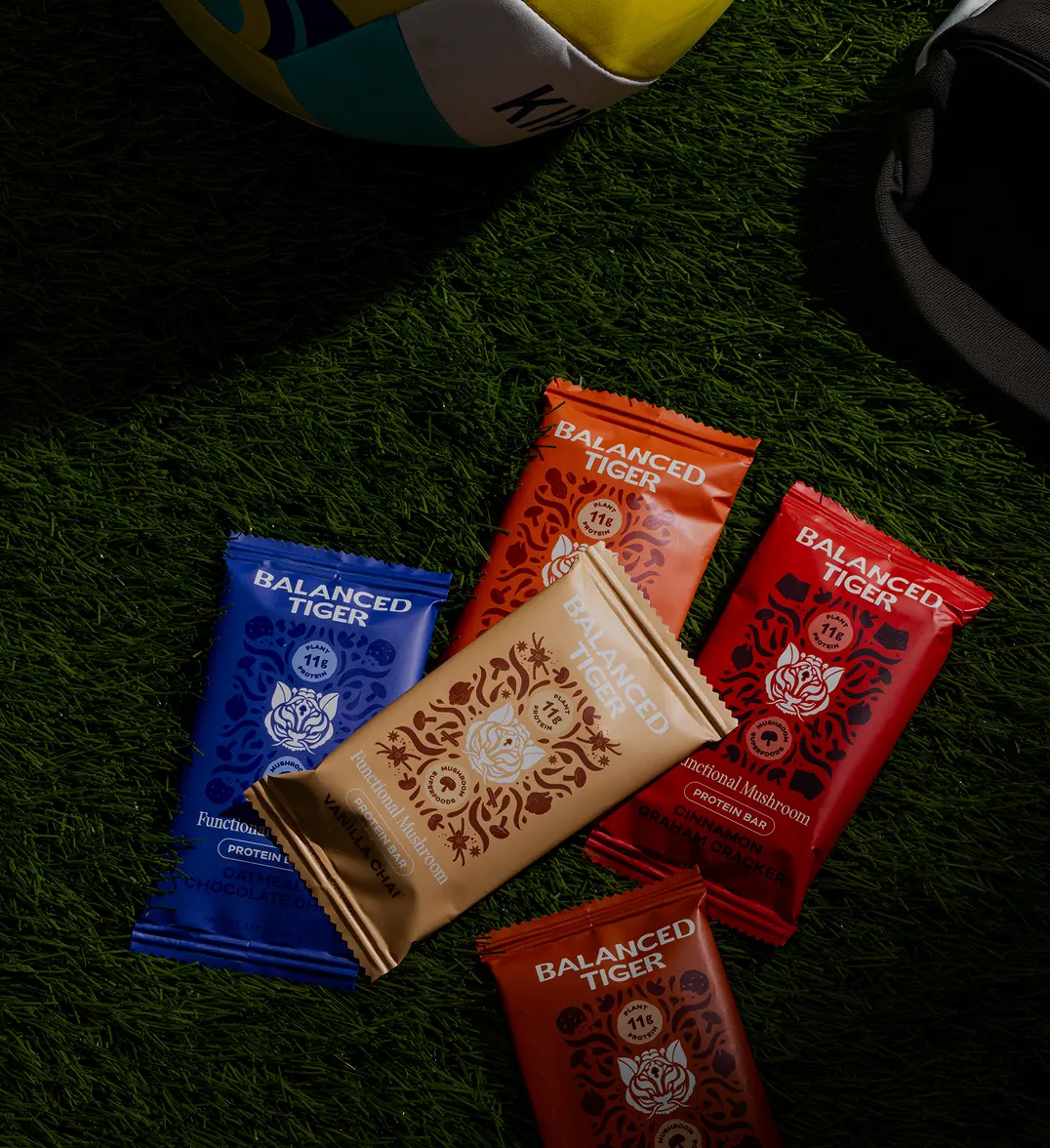 Balanced Tiger spice packets on grass