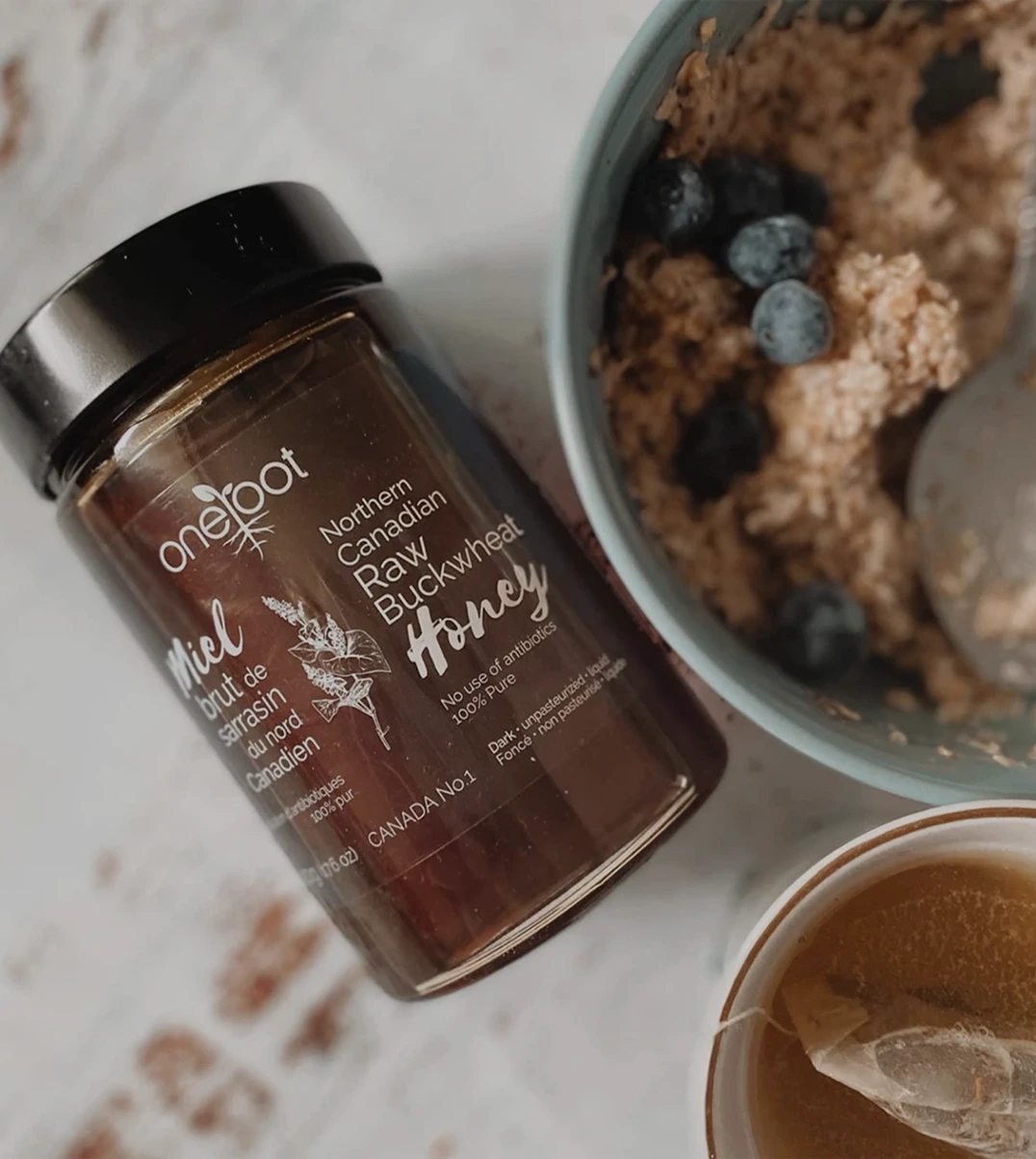 One Root raw honey jar with oatmeal bowl