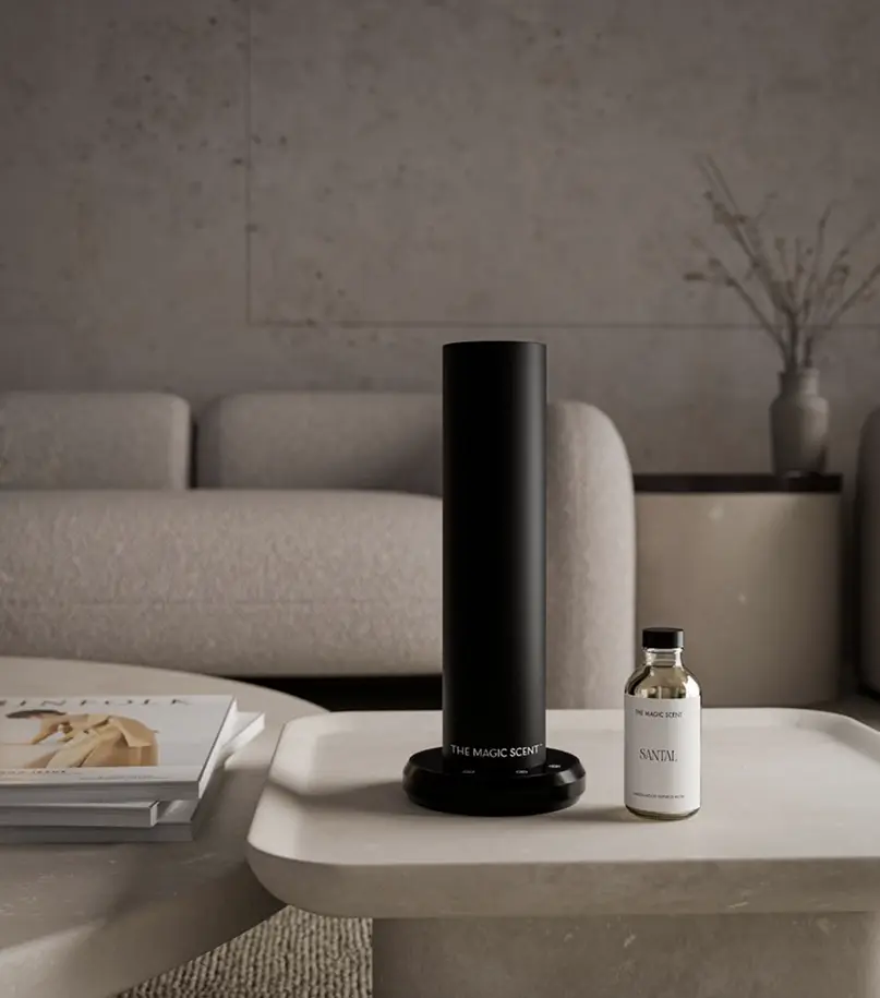 The Magic Scent black diffuser and fragrance bottle on coffee table