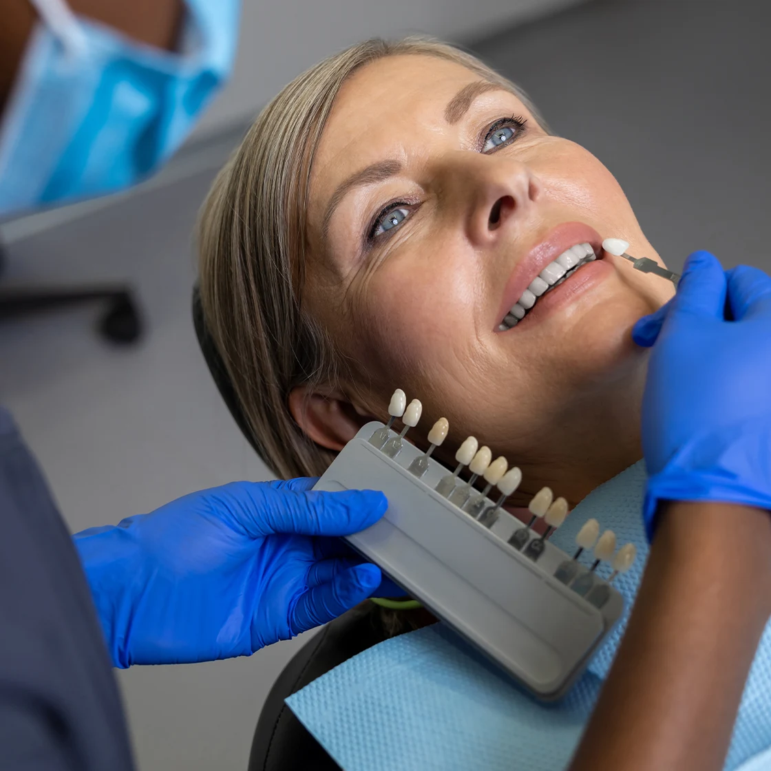 A patient smiles while testing a shades