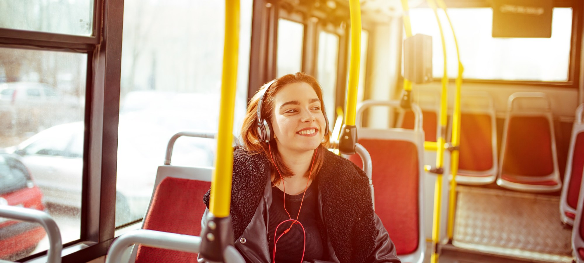 Woman smiling on a bus