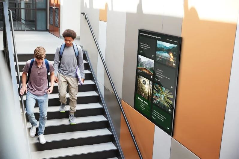 Digital Signage in a stairway at school