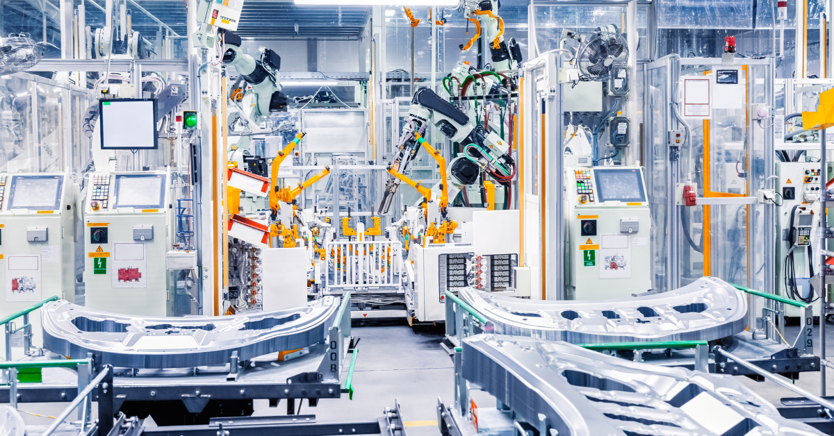 Modern autonomous factory with industrial robots, automated machinery, and control panels, illustrating advanced manufacturing automation.