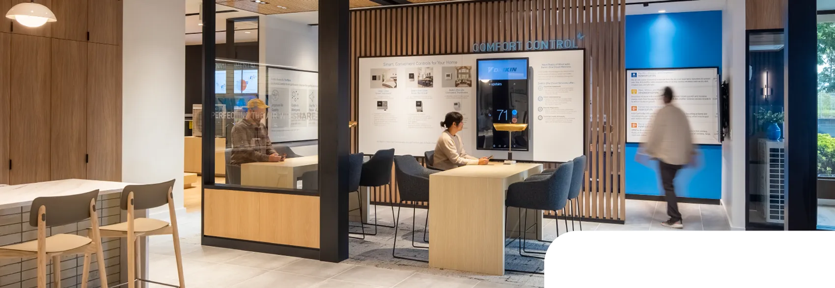 Daikin showroom interior with comfort control display and customers