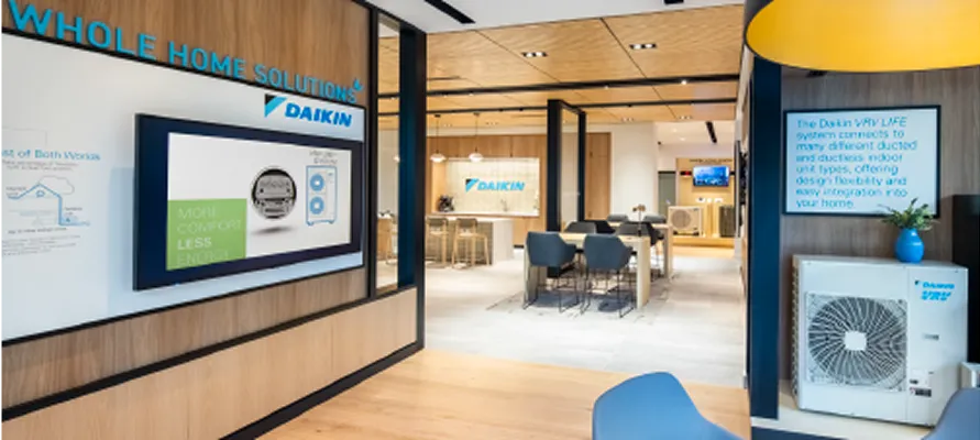 Daikin showroom interior with air conditioning units and display screens