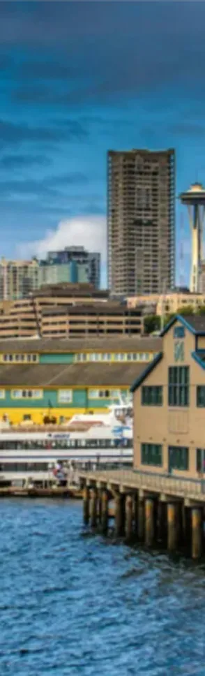 Seattle waterfront with pier, skyscrapers, and Space Needle in background