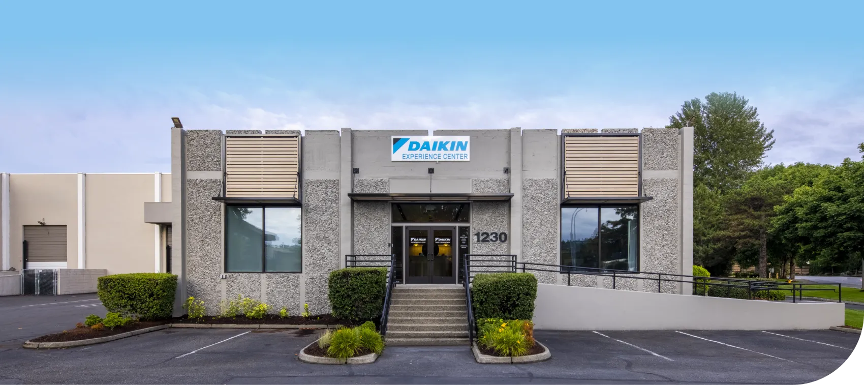 Daikin Experience Center building with landscaped entrance and parking lot
