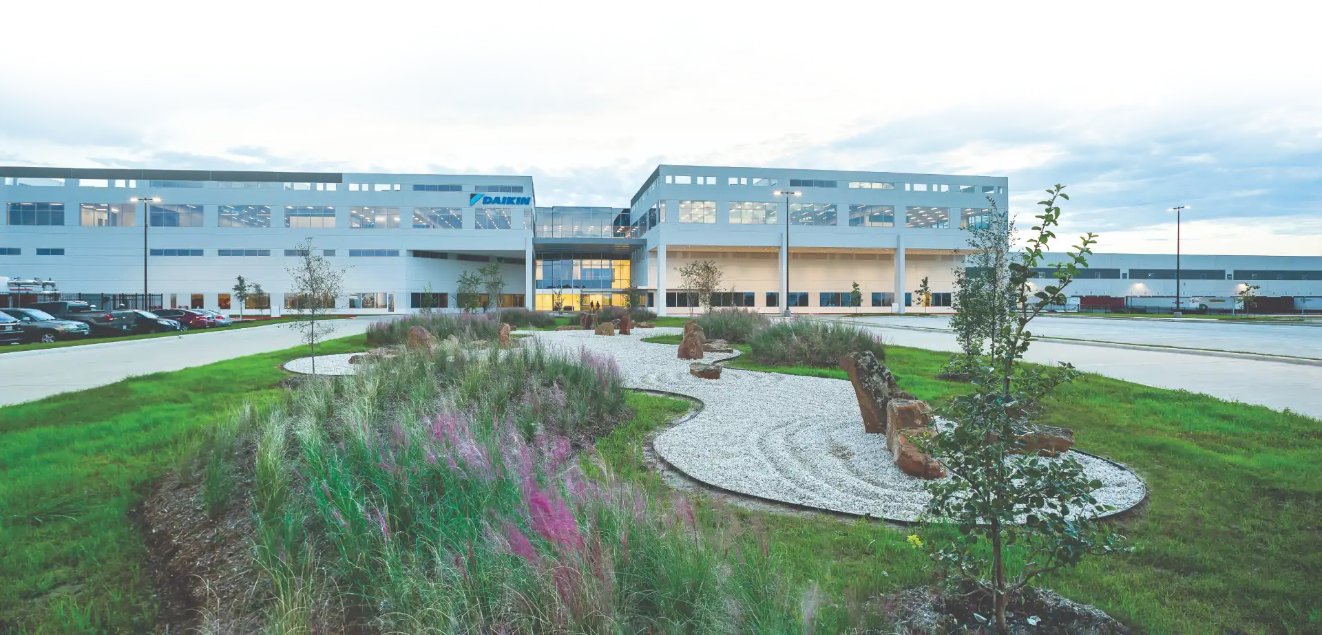Daikin office building with modern landscaped garden and white gravel path