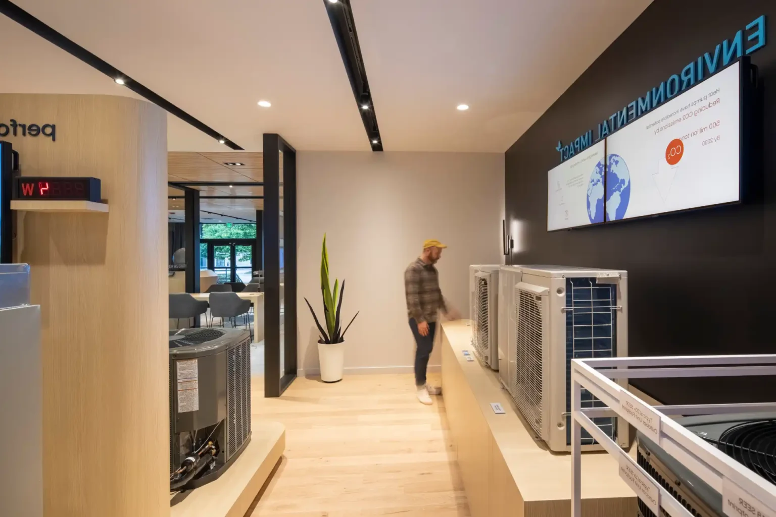Modern environmental technology showroom with air conditioning units and display