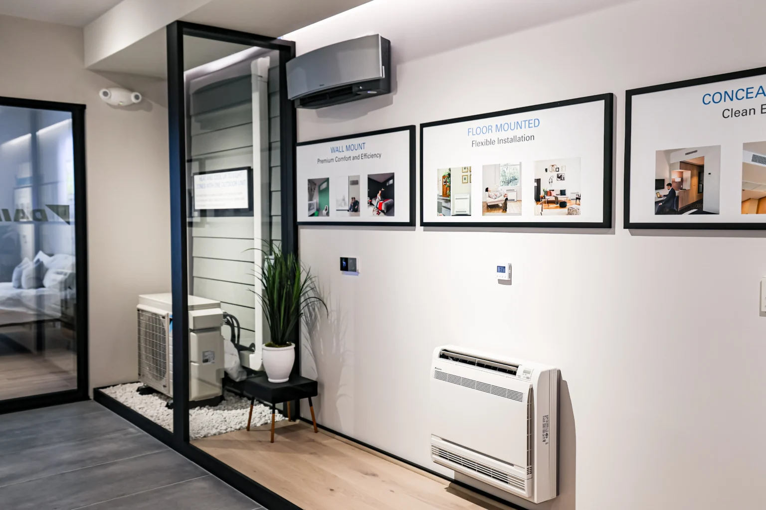 Air conditioning showroom with wall-mounted units and installation displays