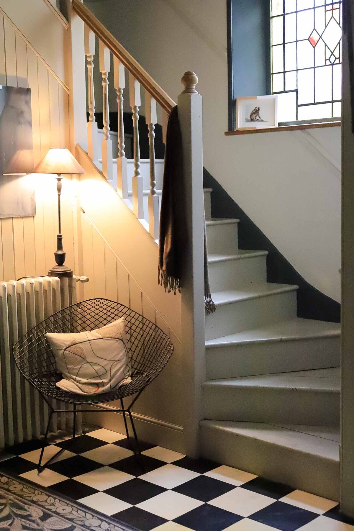A hallway with a staircase