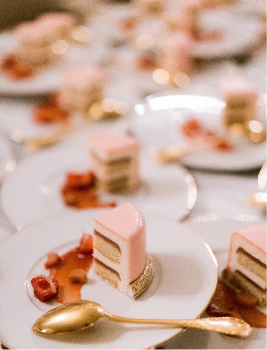 slices of raspberry and vanilla wedding cakes
