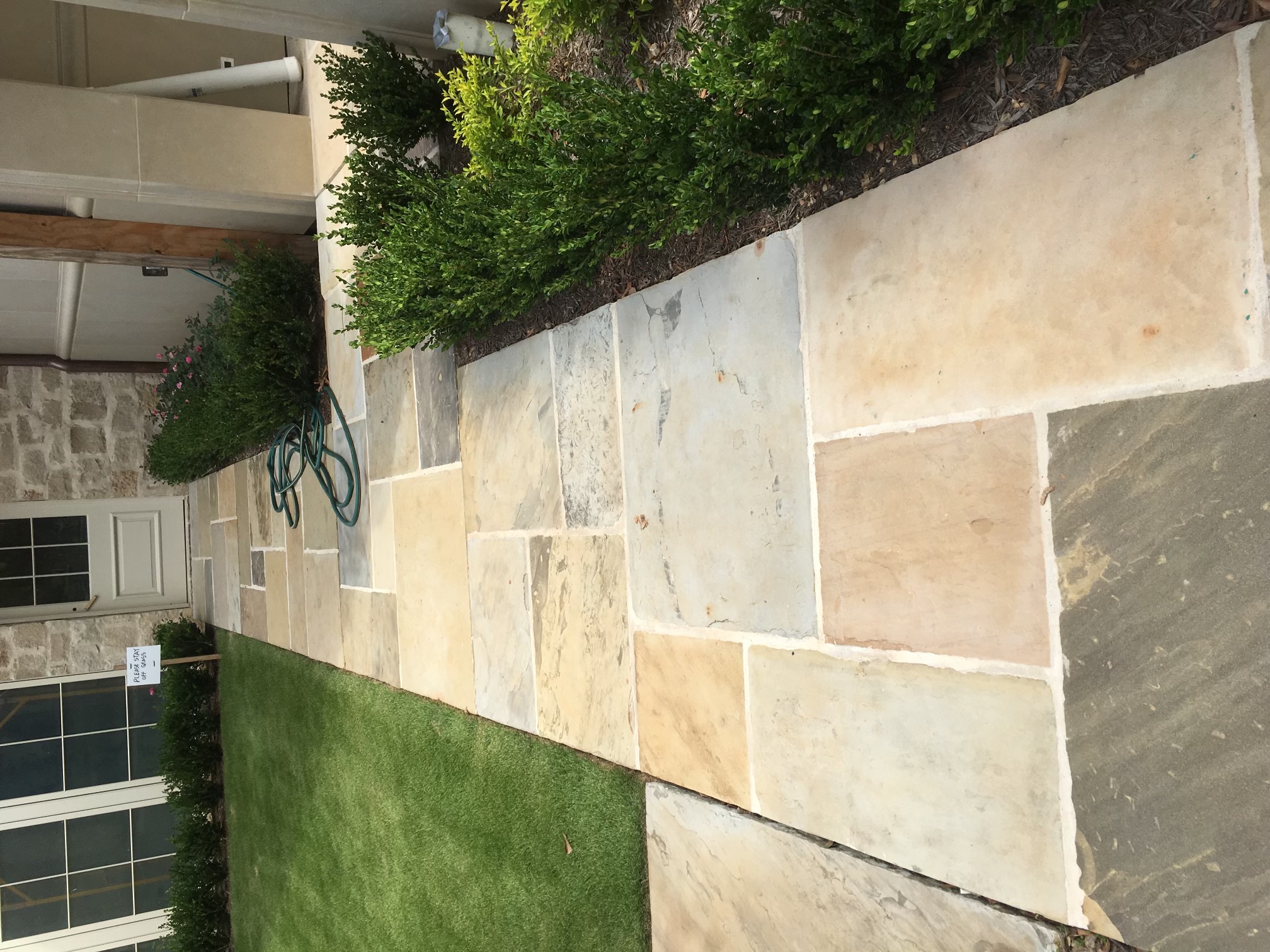 Reclaimed stone and setts stacked in the yard