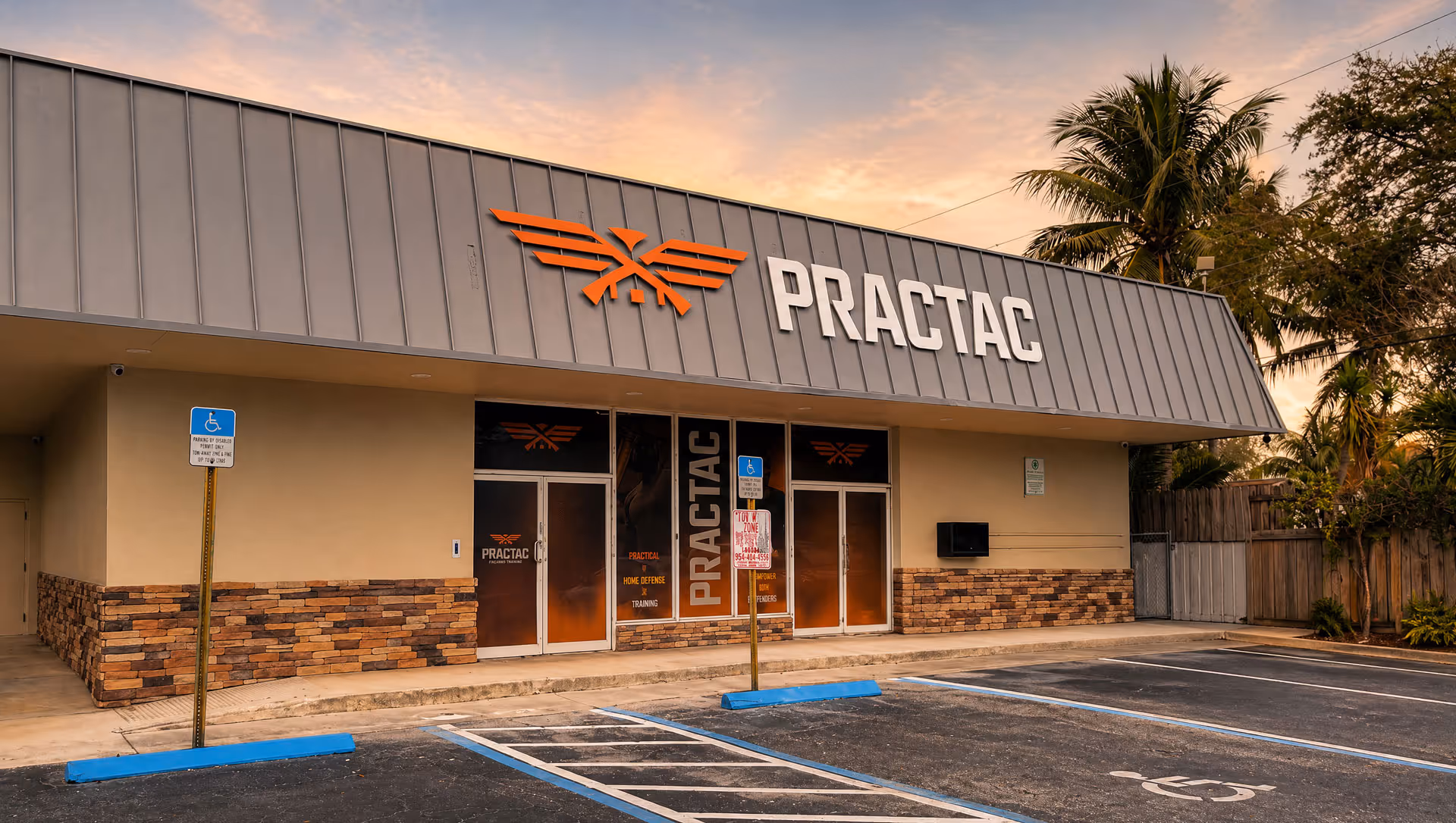 PracTac Defense Training building exterior with illuminated signage at sunset.