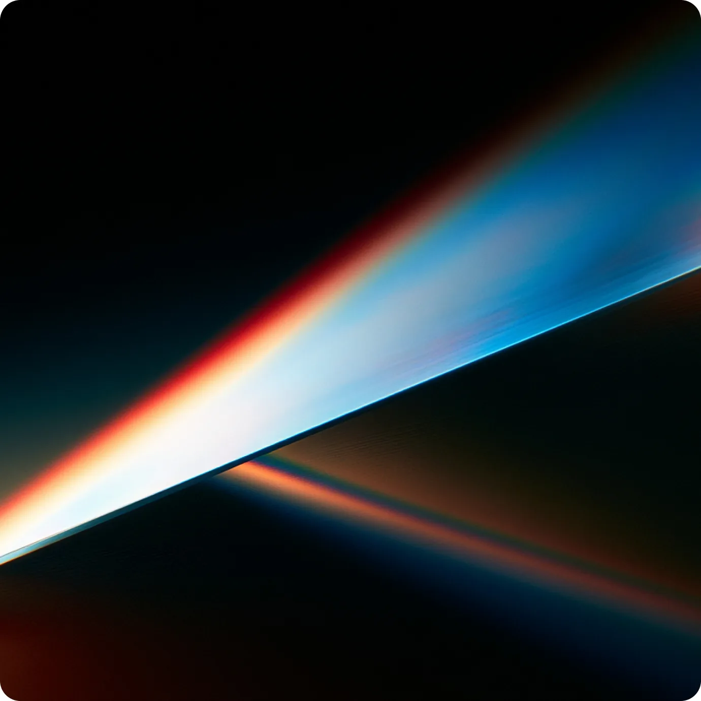 A beam of white and blue light cutting diagonally through darkness