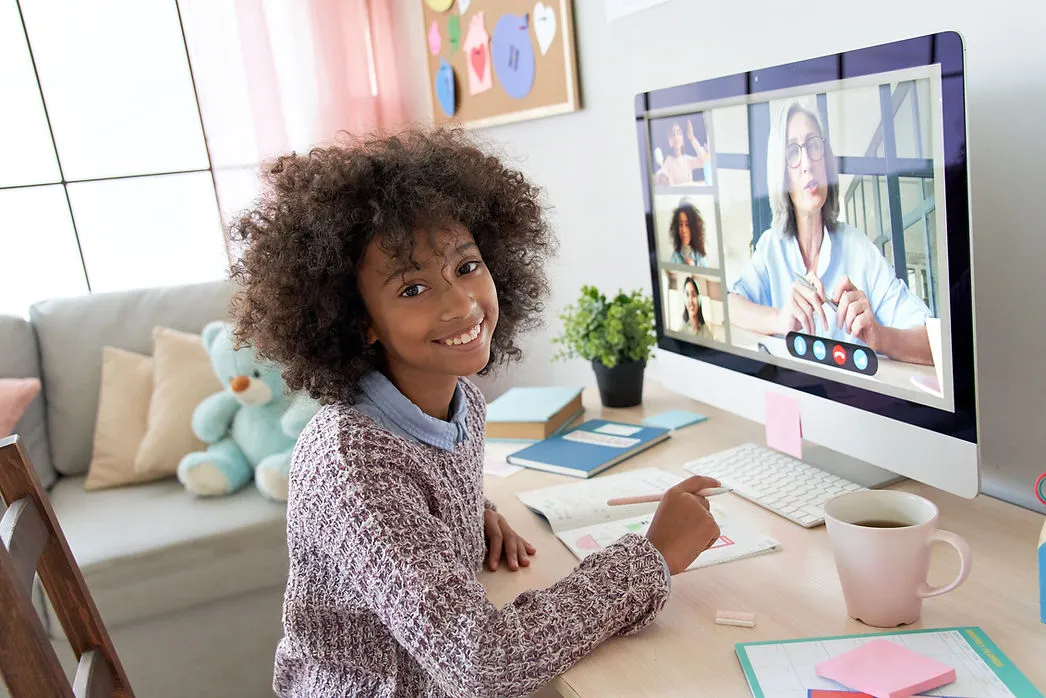 girl-smiling-while-taking-online-class-impact-of-teacher-quality-on-student-success-edge-tutor-proven-results-edge-tutor