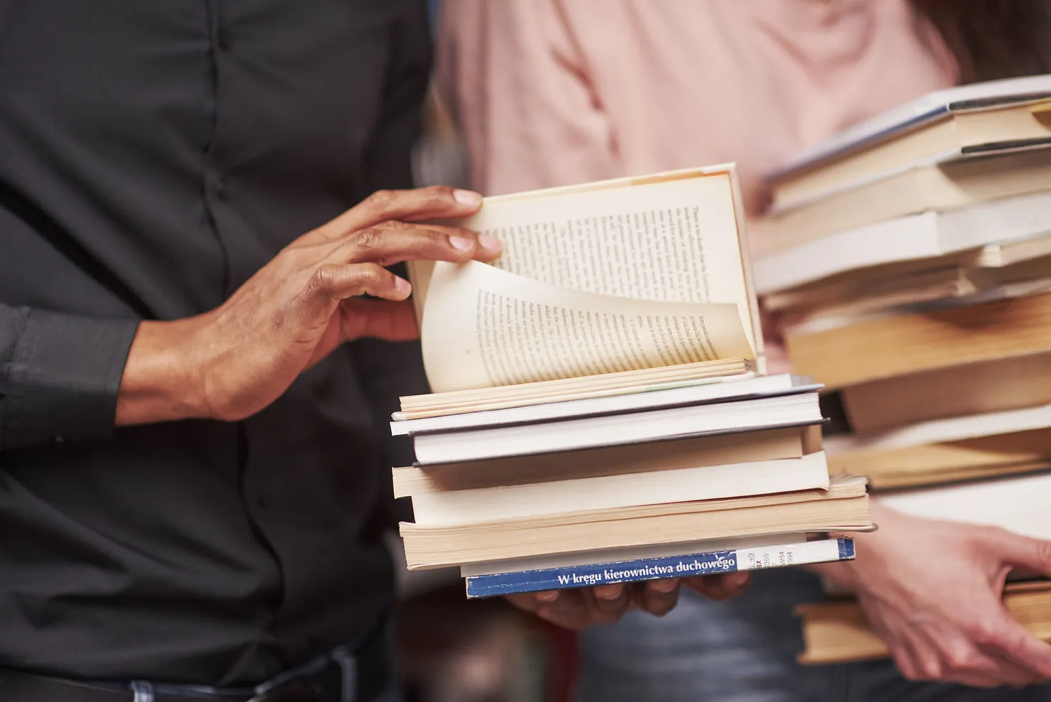 man-opening-stacked-books-how-to-expand-and-improve-your-vocabulary-a-step-by-step-guide-edge-tutor