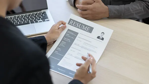 recruiter-checking-resume-effective-screening-techniques-for-online-tutor-recruitment-edge-tutor