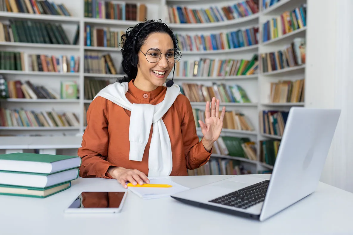 online-teacher-saying-hi-on-laptop-aligning-online-tutoring-curriculum-with-evolving-educational-needs-edge-tutor