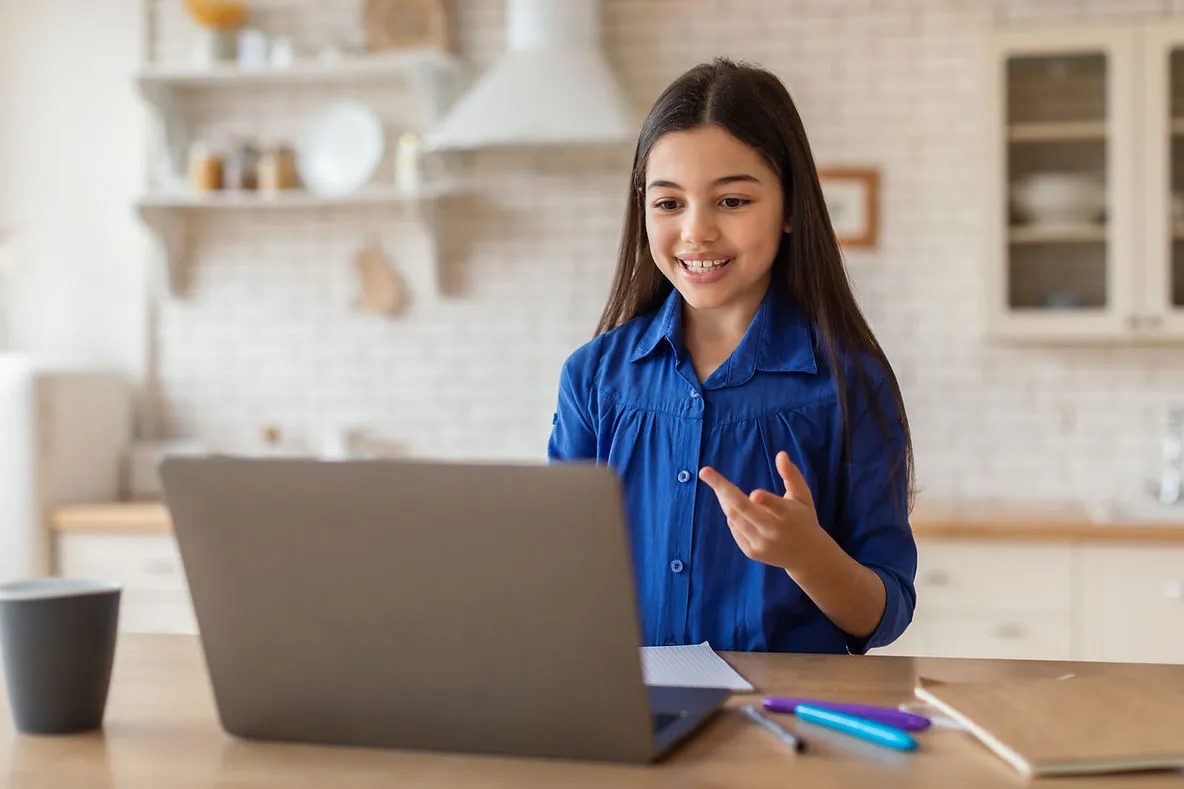 girl-talking-to-laptop-online-lesson-ensuring-quality-assurance-in-online-tutoring-edge-tutor
