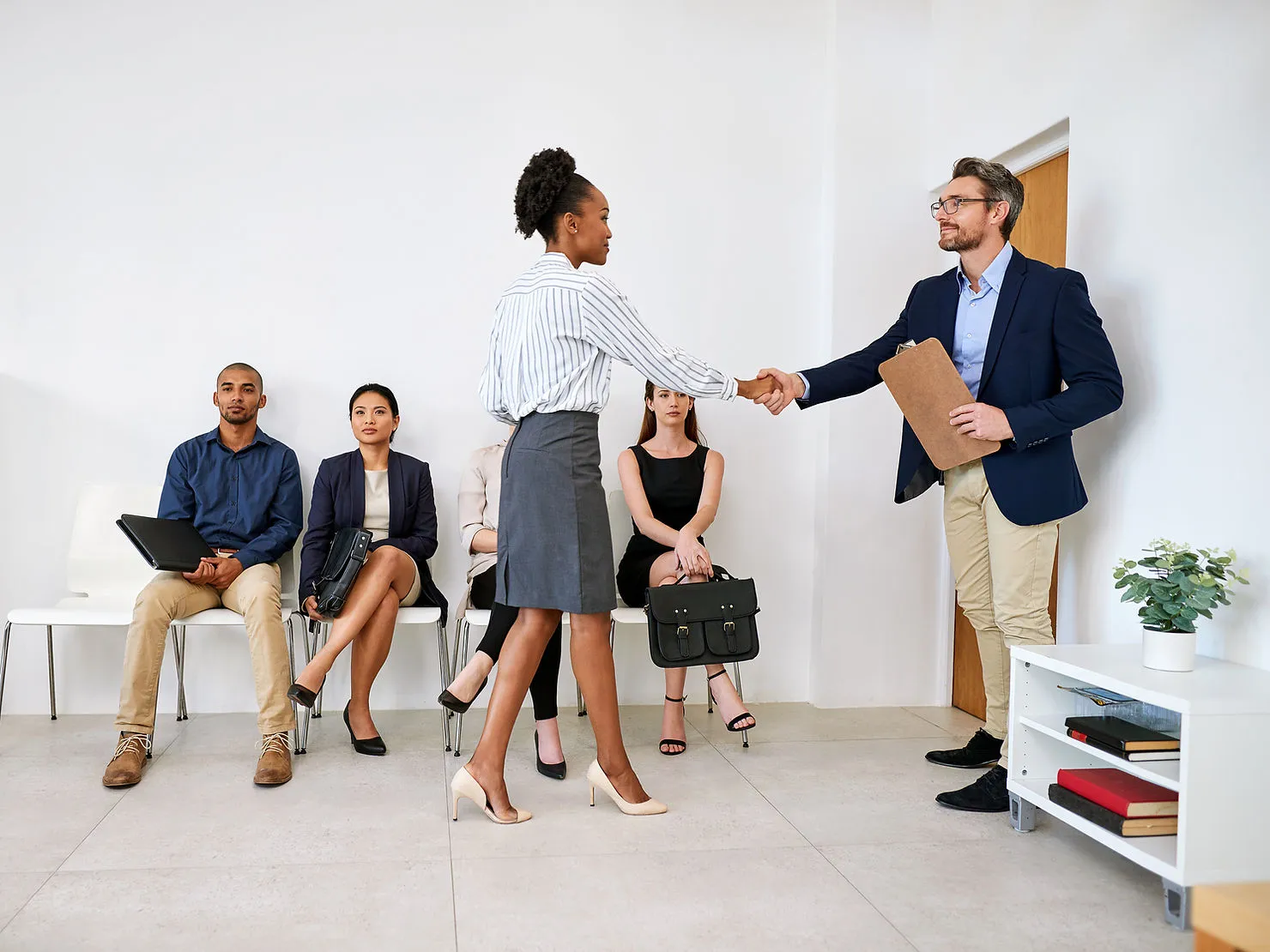 group-of-business-people-seated-in-line-while-waiting-to-be-interviewed-how-to-attract-reliable-online-tutor-candidates-edge-tutor