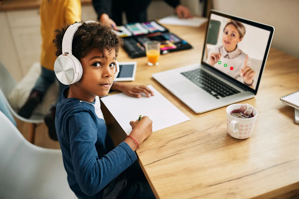 boy-wearing-headphones-online-lesson-the-role-of-continuous-professional-development-in-managing-teacher-quality-at-edge-tutor