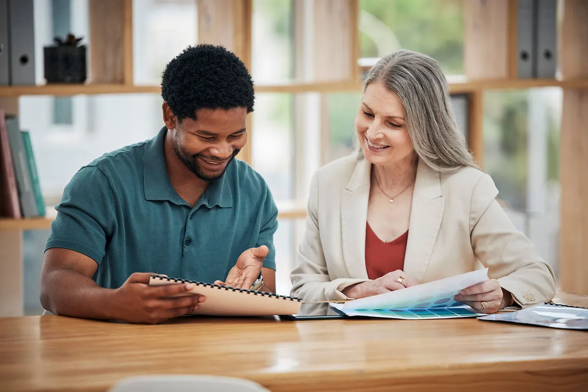 man-and-woman-discussing-looking-at-documents-the-role-of-pronunciation-drills-in-1-1-adult-esl-lessons-edge-tutor