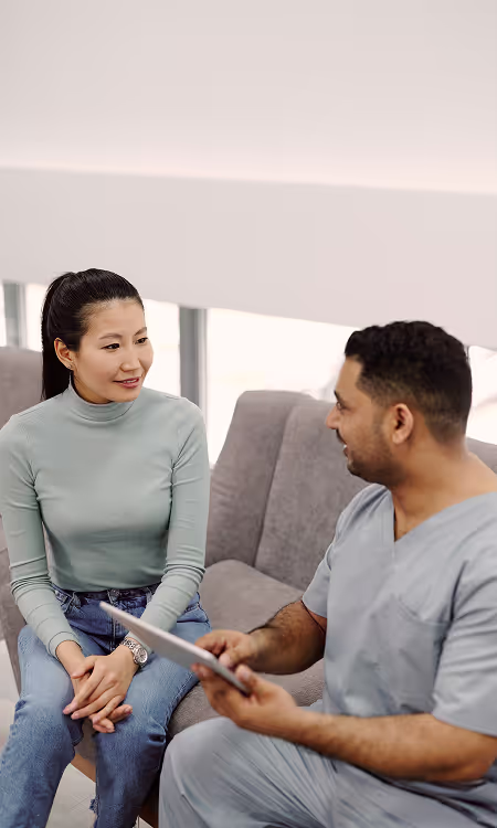 Doctors discussing a chart on a tablet