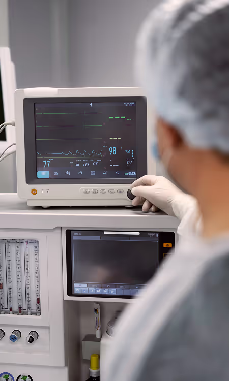 Doctor looking at results on a monitor