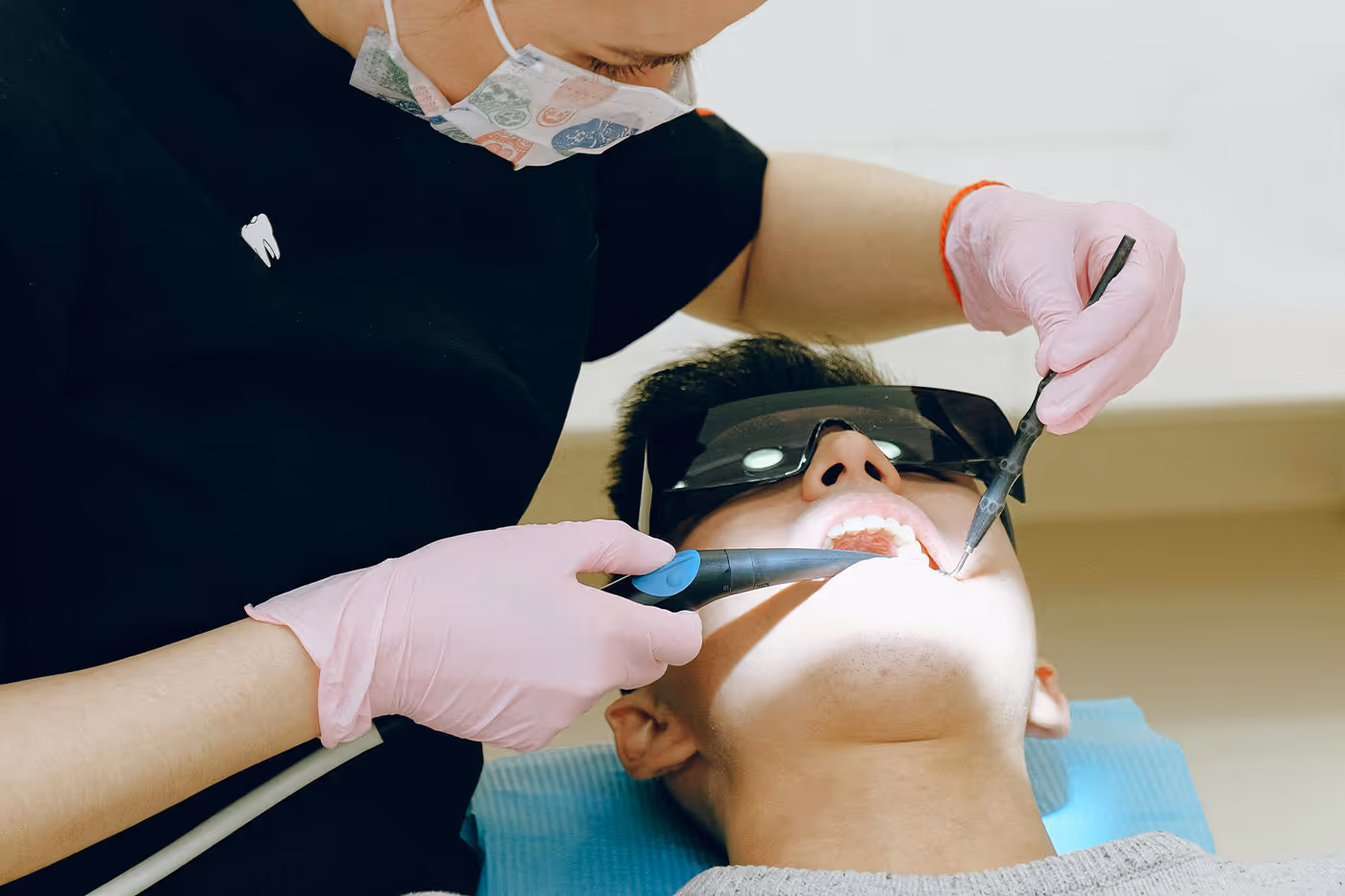 Oral surgeon treating a patient