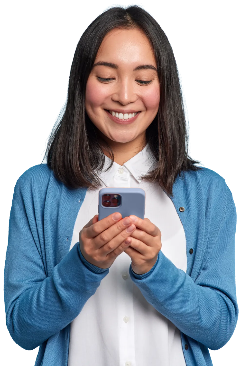 Smiling woman in a blue cardigan looking at her smartphone.