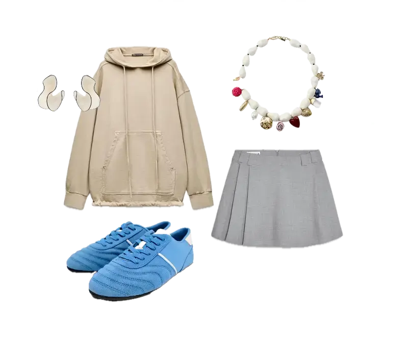 moletom oversized bege, saia cinza de pregas, tênis azuis esportivos, colar de contas coloridas
