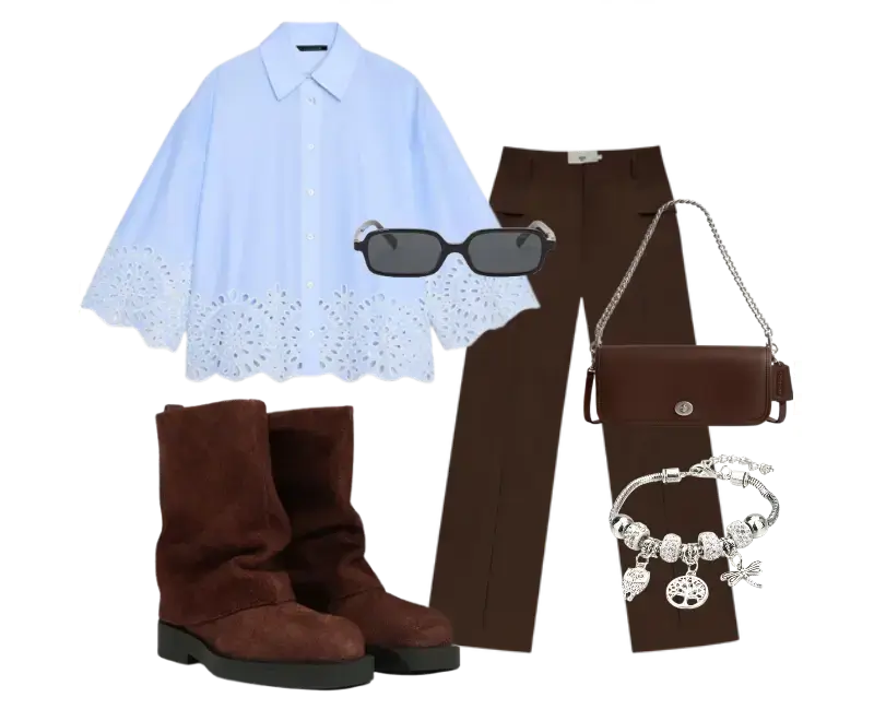 camisa azul clara bordada, calça marrom de alfaiataria, botas de camurça marrom, bolsa tiracolo de couro marrom, bracelete prateado com pingentes, óculos de sol escuros