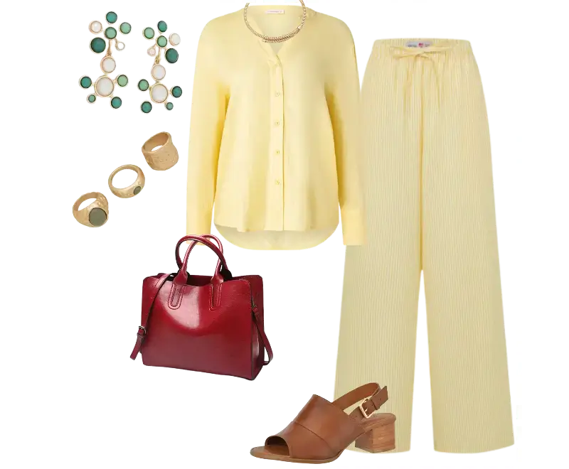 blusa de botão amarela suave, calça ampla de linho listrada, sandálias marrons de salto bloco, bolsa estruturada de couro vermelha, brincos de pedras verdes, anéis dourados
